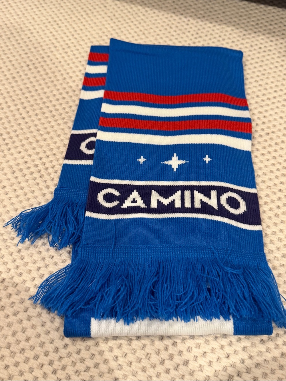 Blue Knit Scarf with Red and White Stripe Accents